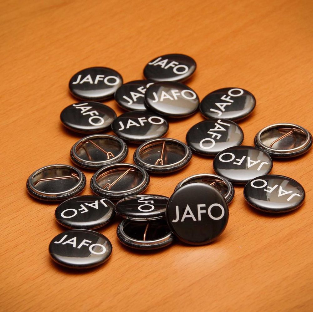 A desk covered with 1" black pins with the letters JAFO on them in white block capitals. JAFO. Just Another Observer. The ‘F’ is flexible...