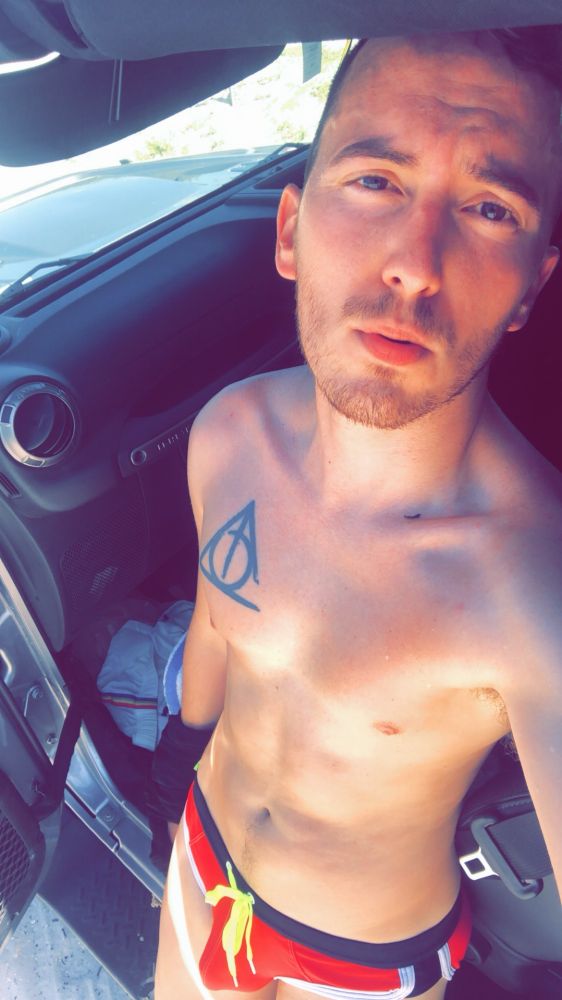 Josh in a red swim brief/speedo. 