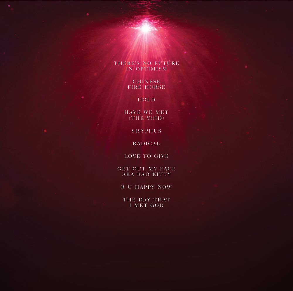 Let All That We Imagine Be The Light back cover with track titles 