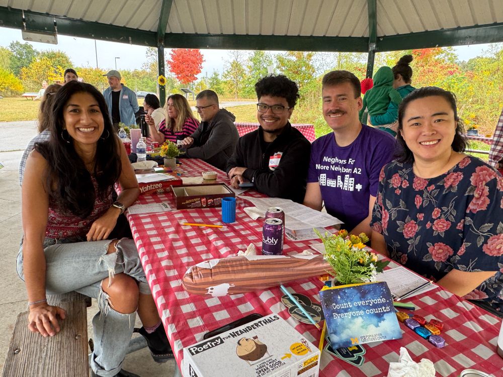 Nafeesa Andrabi, Alexander Adames, Joe Labriola and Hannah Tessler at the gingham picnic table