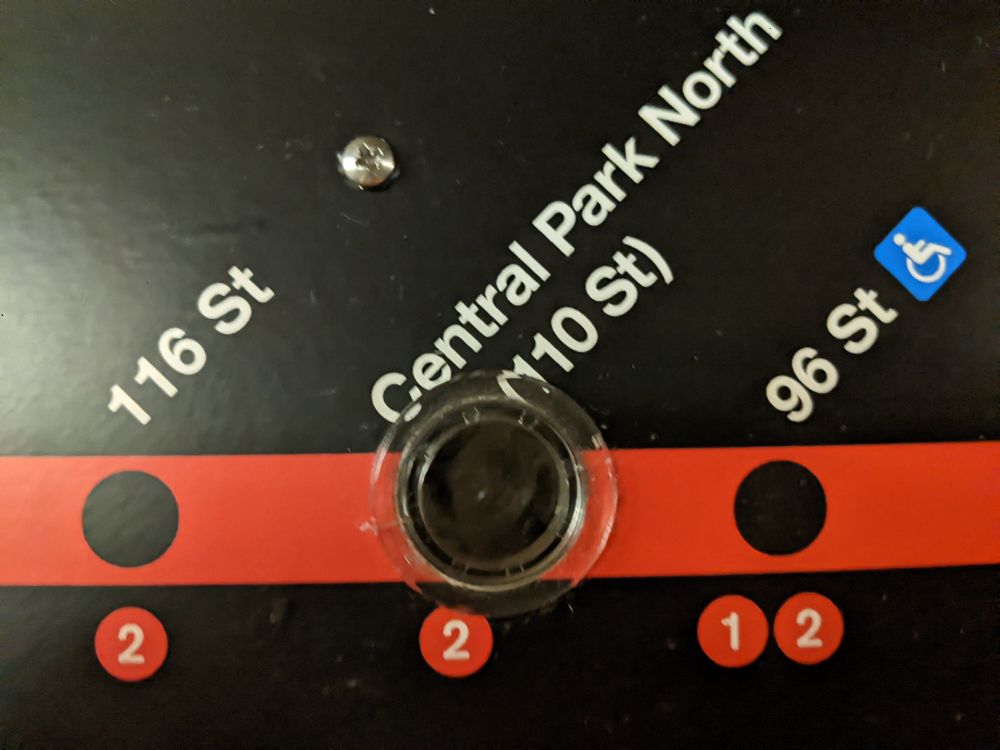 A close up of a disguised surveillance camera posing as a Central Park North (110 St) stop. 