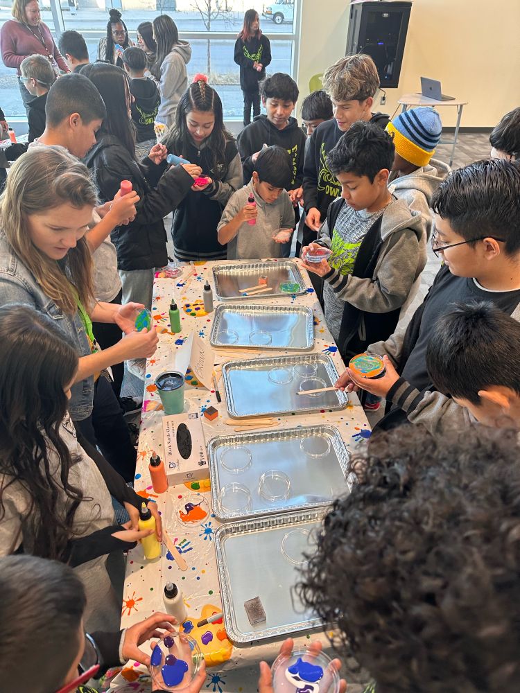 Aurora STEM students making art out of Petrie dishes