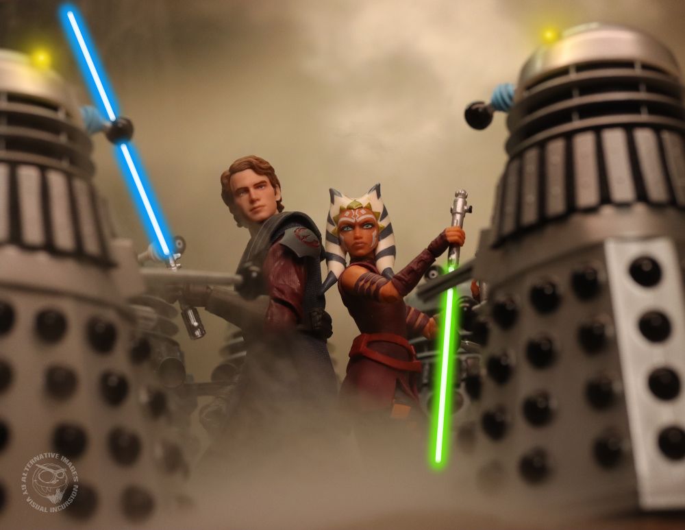 Anakin Skywalker and Ahsoka Tano surrounded by Daleks. Their lightsabers are lit and they are about to take the daleks down. 