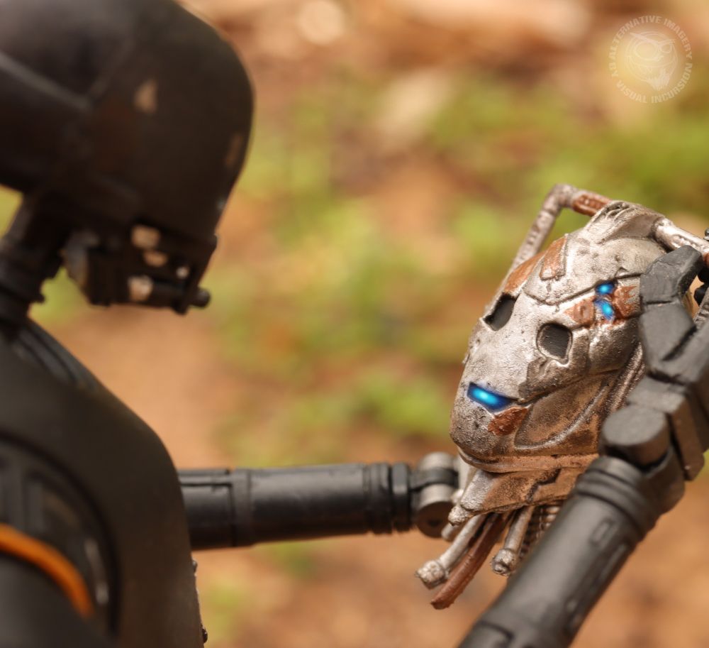 K2SO holds Handles' head as Handles begins to shut down and go offline. 