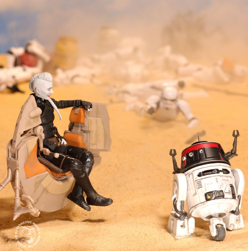 Pokkit sits on a speeder chatting to Chopper in Scots. Behind them is a Stormtrooper patrol that has just been wiped out by Chopper. A Stormtrooper left alive is crawling towards them. 