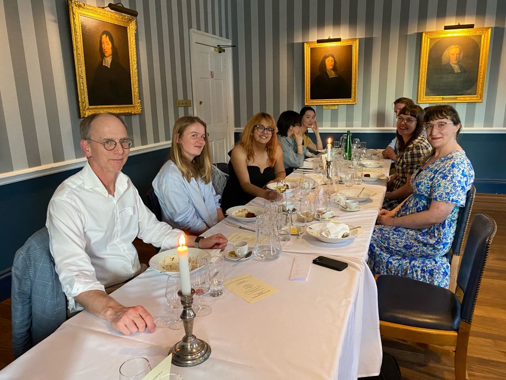 A group of people sitting at a table for a formal dinner.