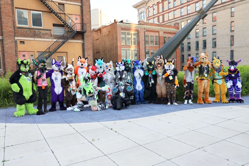 A large gathering of Starcane Arts fursuiters at the David L Lawrence convention center in Pittsburgh during Anthrocon 2025