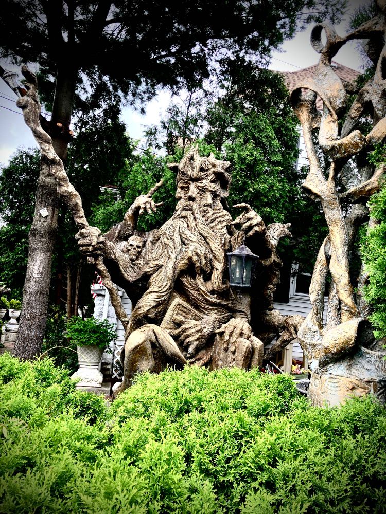 A most bizarre sculpture of an ancient, multi-faced, multi limbed. and possibly pagan deity.