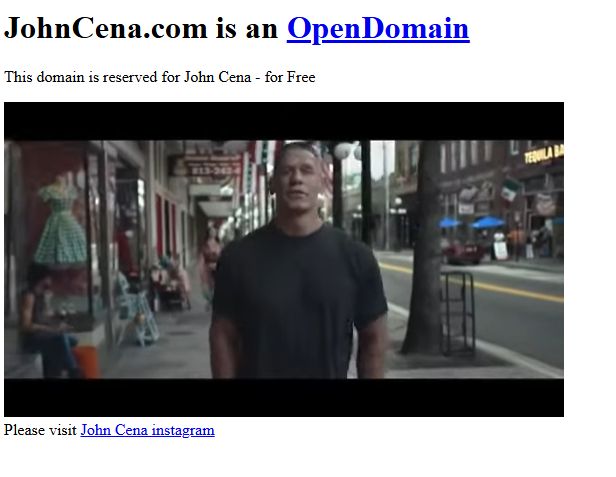 A screenshot of JohnCena.com. It says "JohnCena.com is an OpenDomain. This domain is reserved for John Cena - for Free. Please visit John Cena instagram. There is a video of John Cena talking to camera embedded on the page. The video is John Cena giving an inspirational speech of what it means to be patriotic about America.