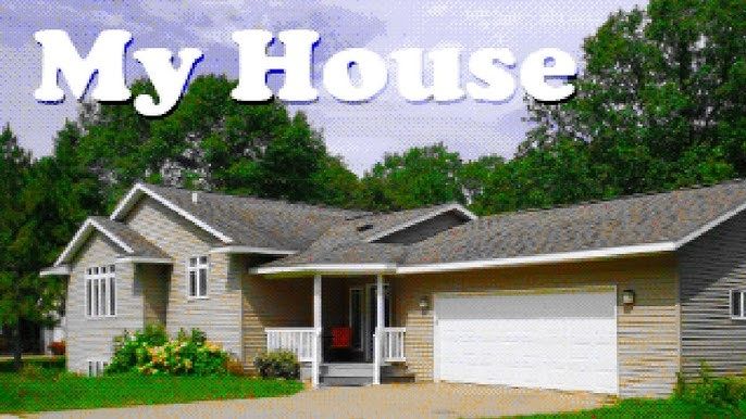 The outside of a Suburban House. A large garage on the right, a covered porch entryway in the middle, and windows for an upper and basement level on the left. A large driveway and Lawn. A large caption that says "my house." 