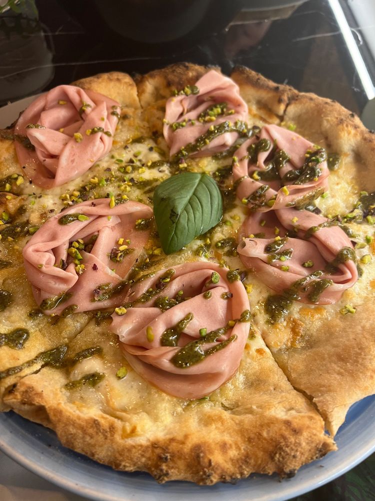 A mortadella, pistachio pesto, pistachio pizza (gf)
