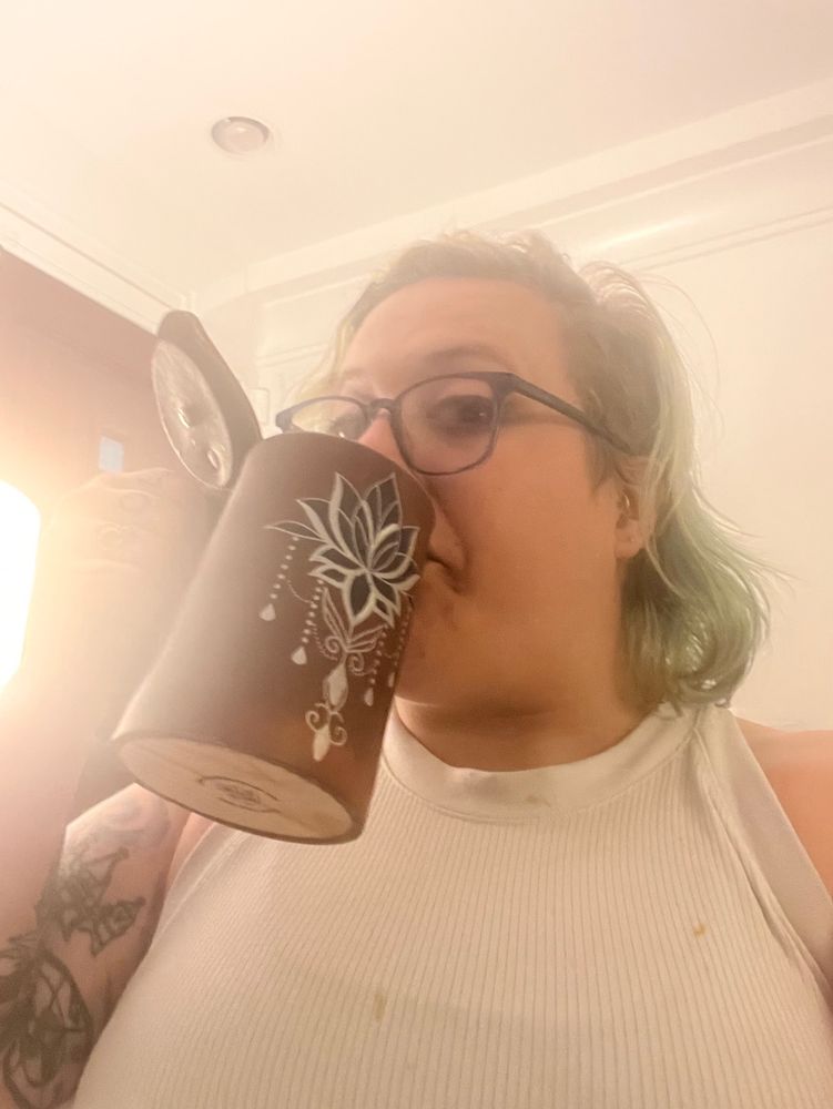 Diane holds a renfair mug she intends to use for hobbit day