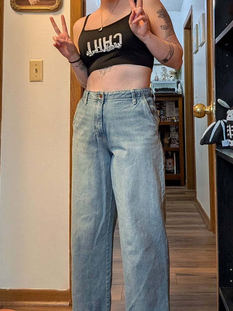 me showing off my new wide leg jeans