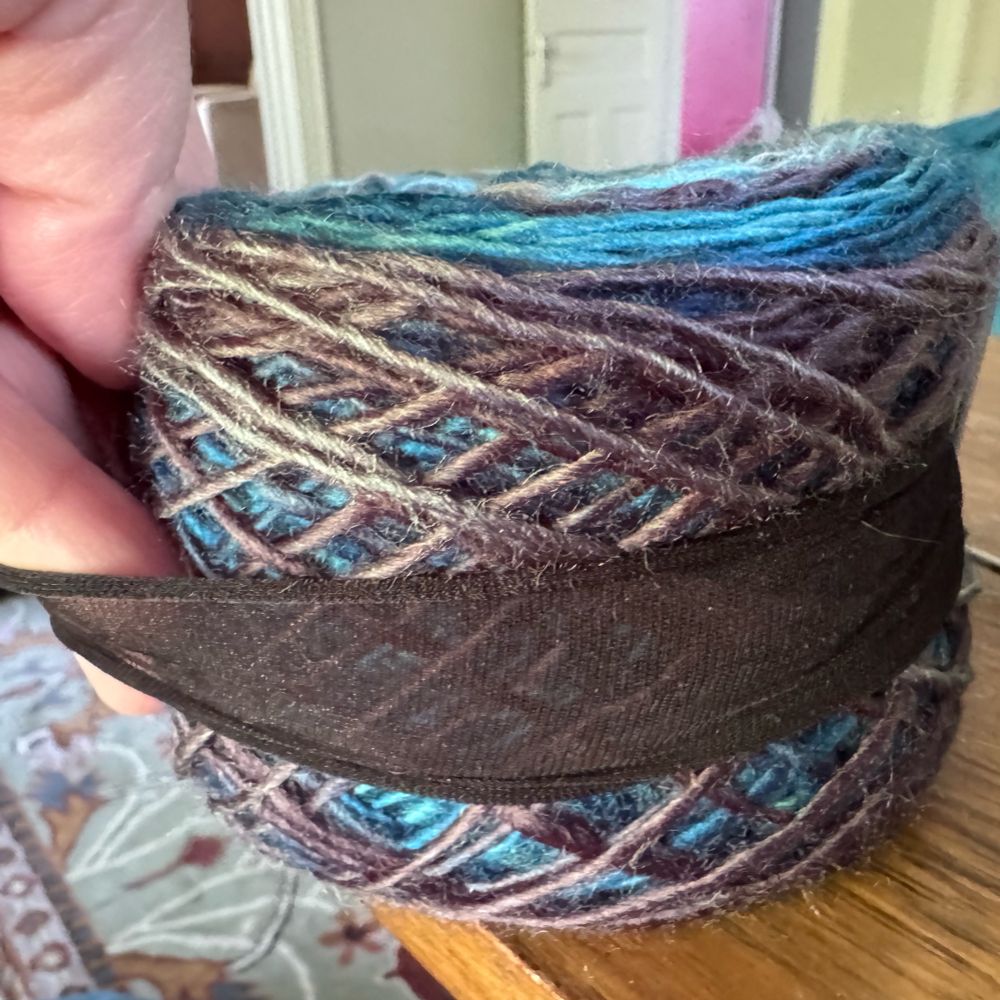 Put the nylon tube around your yarn cake.