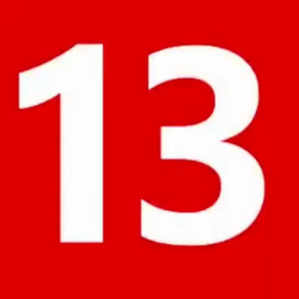 the number 13 is red and white on a white background .