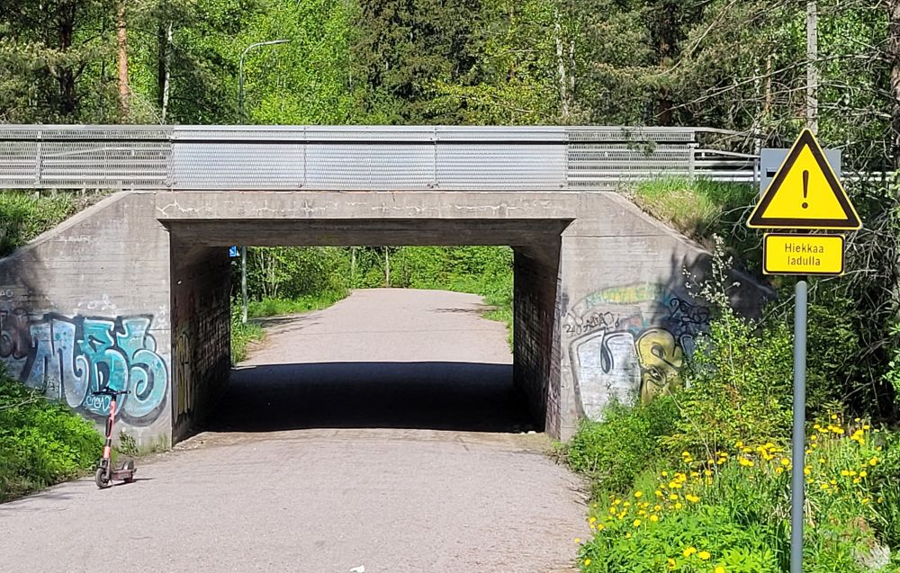 Summer landscape with a "sand on a skiing track" -warning dign.