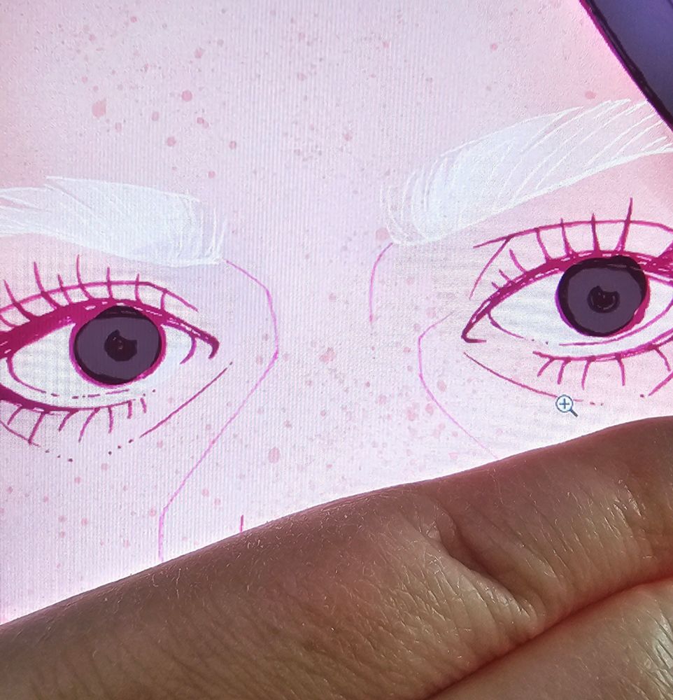 A hand hiding the lower part of a feminine face with big dark eyes and black hair. The woman has long doll-like lashes and bleached eyebrows. 