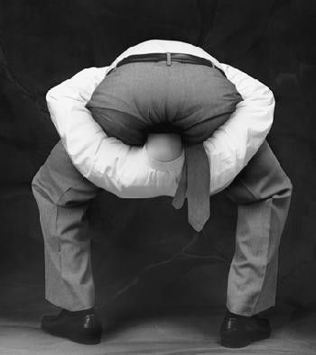 An image of a guy with his head literally up his ass.