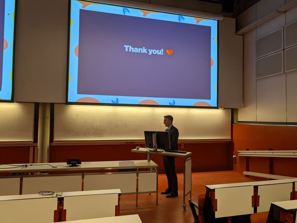 Photo of myself during the disputation with a "thank you" slide in the background