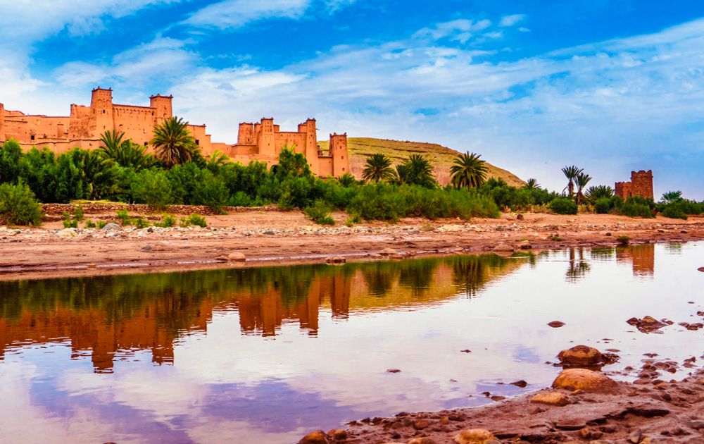 The Ksar of Ait-Ben-Haddou mirrored in the river in Morocco.
