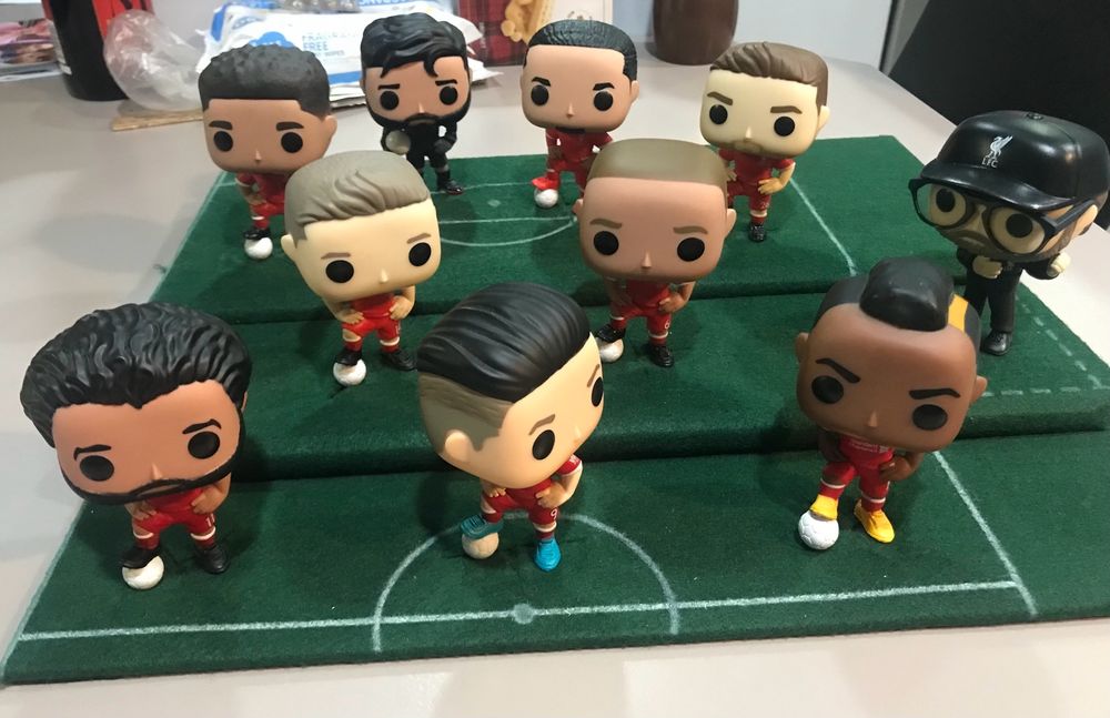 Team of LFC pop vinyls on felt pitch