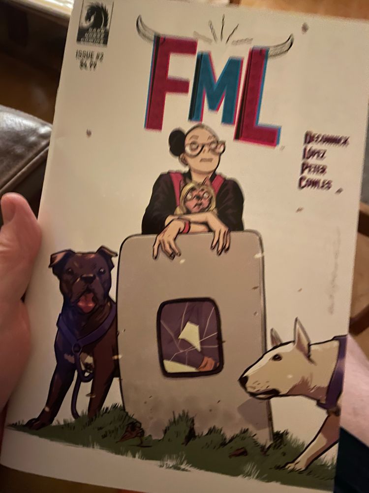 The cover of the 2nd issue of FML, featuring a woman, 3 dogs, and the door from an airplane.