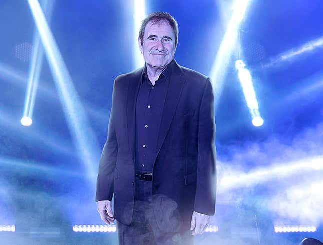 Richard Kind, surrounded by spotlights at the superbowl.