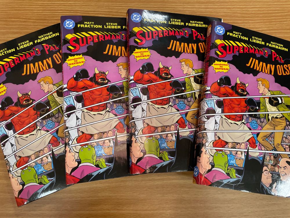 Four copies of the deluxe Jimmy hardcover. 