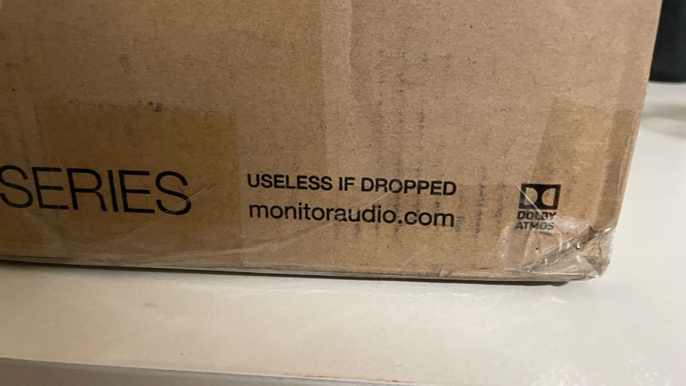 Image of the side of a cardboard box with the text “Useless if dropped” printed. 