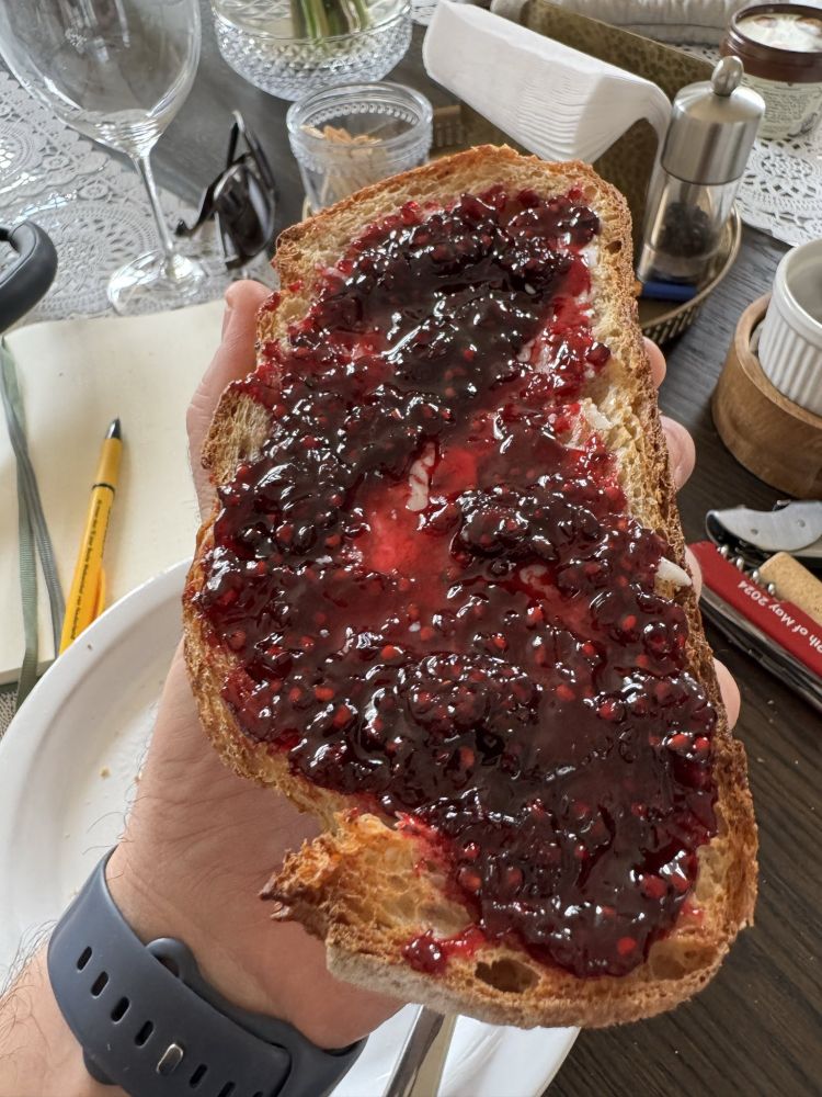 Jam on sourdough toast with butter underneath. Delicious