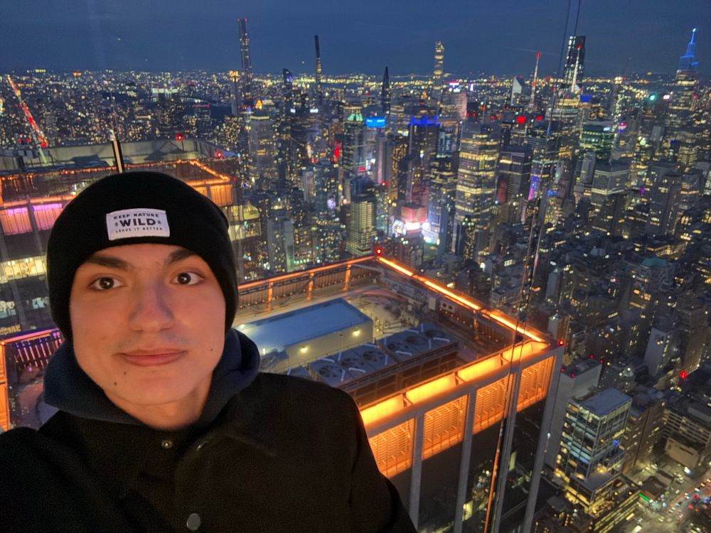 Selfie of me on the observation deck of The Edge, with a view of the Manhattan skyline behind me