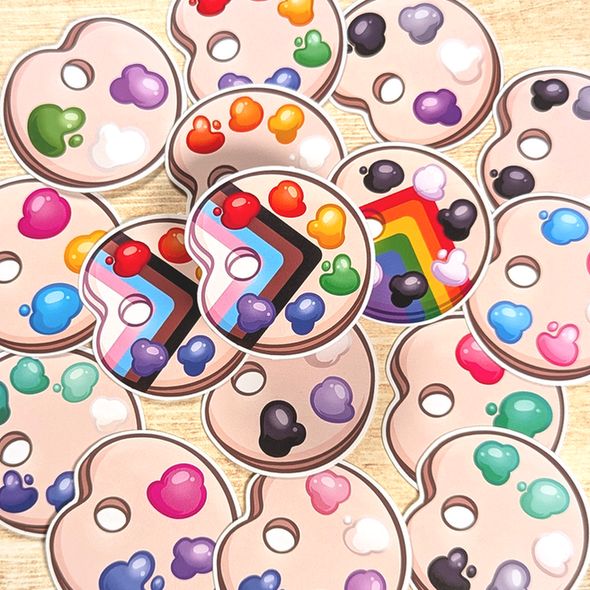 Pride Palettes! Many pride paint palettes are displayed, with different paint splotches representing Pride Flags. The main centered palette is the Progress palette.