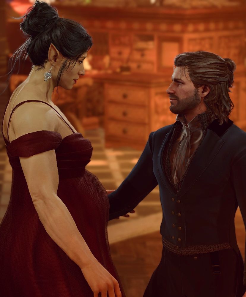 An in game screenshot of my OC Arabella, a tall elven woman, and her shorter human husband Gale Dekarios. They are dressed formally with Arabella in a red gown with her baby bump showing, and Gale in a formal teal waistcoat and trousers. Arabella has black hair tied up in a bun with red lipstick and Gale has mid-length greying brown hair and a beard.
