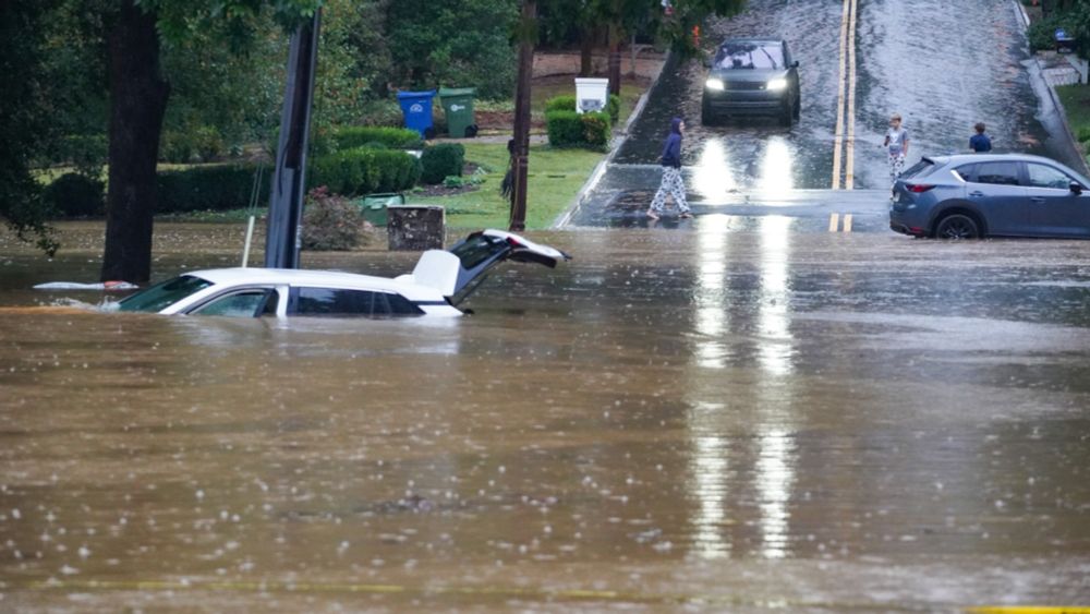 A meteorologist in Atlanta rescued a woman from Helene floodwaters on camera