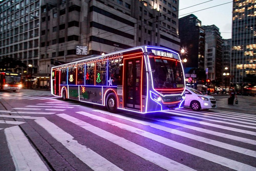 The picture shows a bus in São Paulo, Brazil, fully decorated with Christmas Lights. public initiative to spread cheer around the city during Christmas time.  