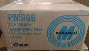 A grainy picture of a cardboard box. It has both the old style M Parafilm logo and Amcor's logo