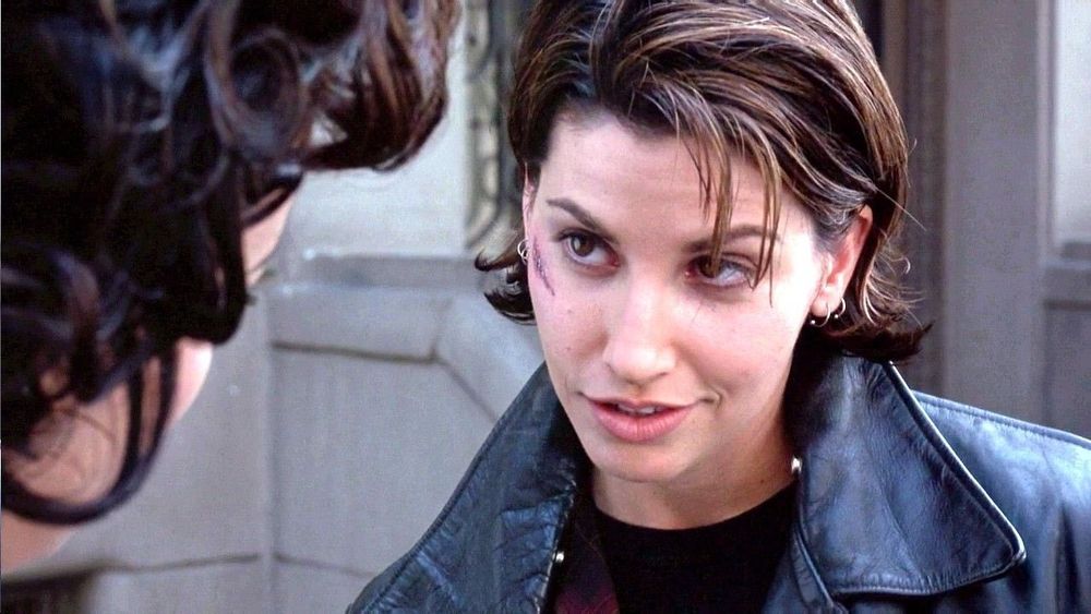 Jennifer Tilly and Gina Gershon look longingly at each other in the film Bound.