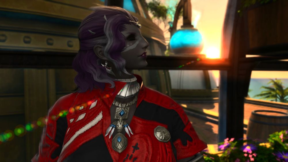 A photo showing a dark grey-skinned Roegadyn woman in a greenhouse with her eyes closed, enjoying the sunset. 