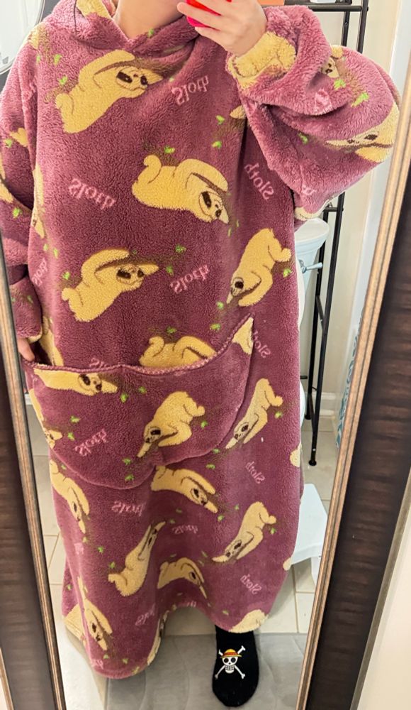 a photo of today’s WFH fit: a floor length, sloth themed fuzzy hoodie with pocket for Arya if she weren’t a meownatee and one piece fur lined fuzzy socks