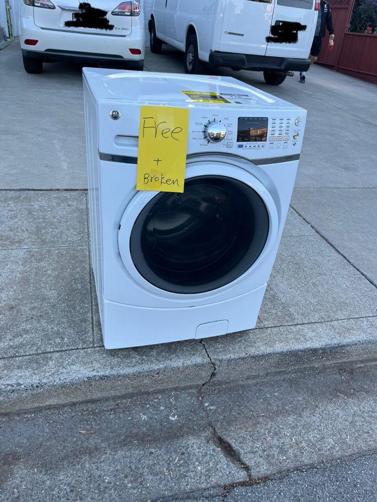 A dryer labeled free and broken