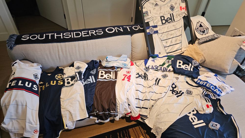 A bunch of Whitecaps jerseys from across the years