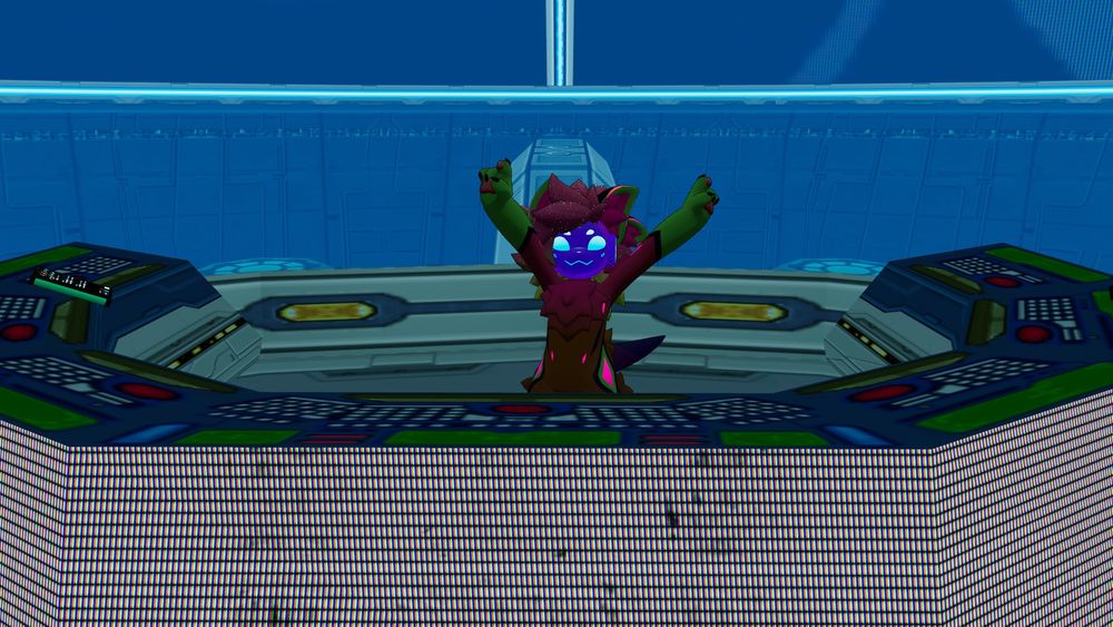 Foxbreaker stands behind a DJ table.