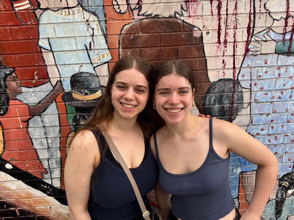 Tzipporah and Yocheved in front of a mural
