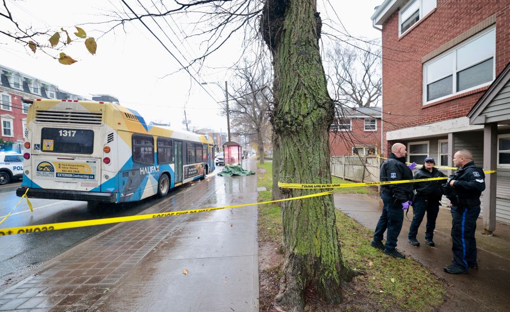 Police officers confer at scene 