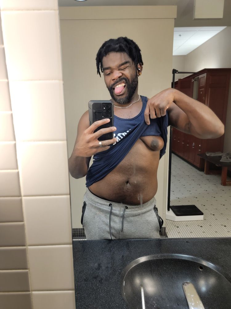 Me after a workout sticking out my tongue. Lifting my shirt with a precariously placed mirror stain.