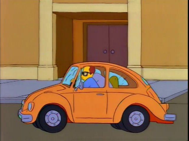 Tall guy in a little car from The Simpsons.