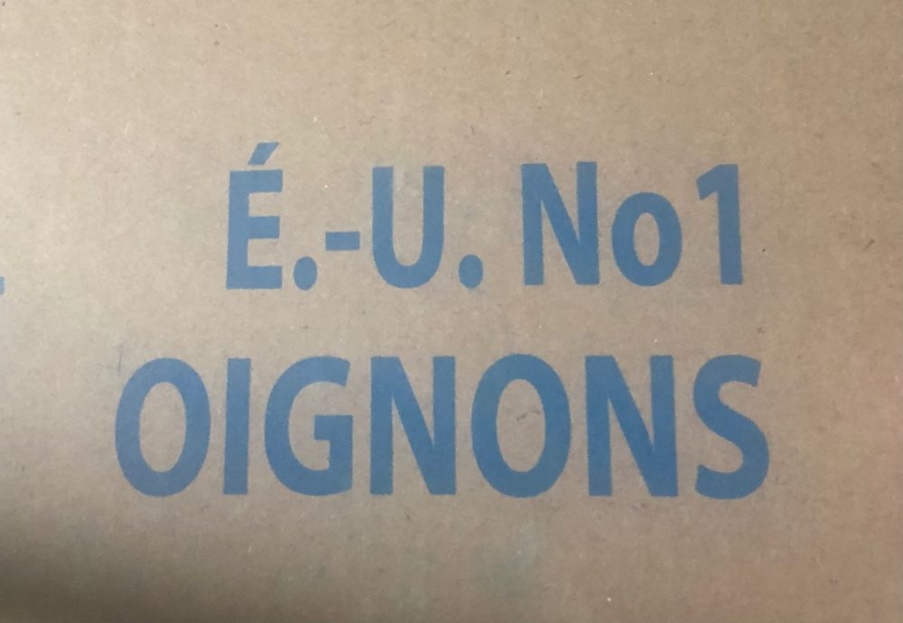 Oignons, French for onion (I think) on a cardboard box.