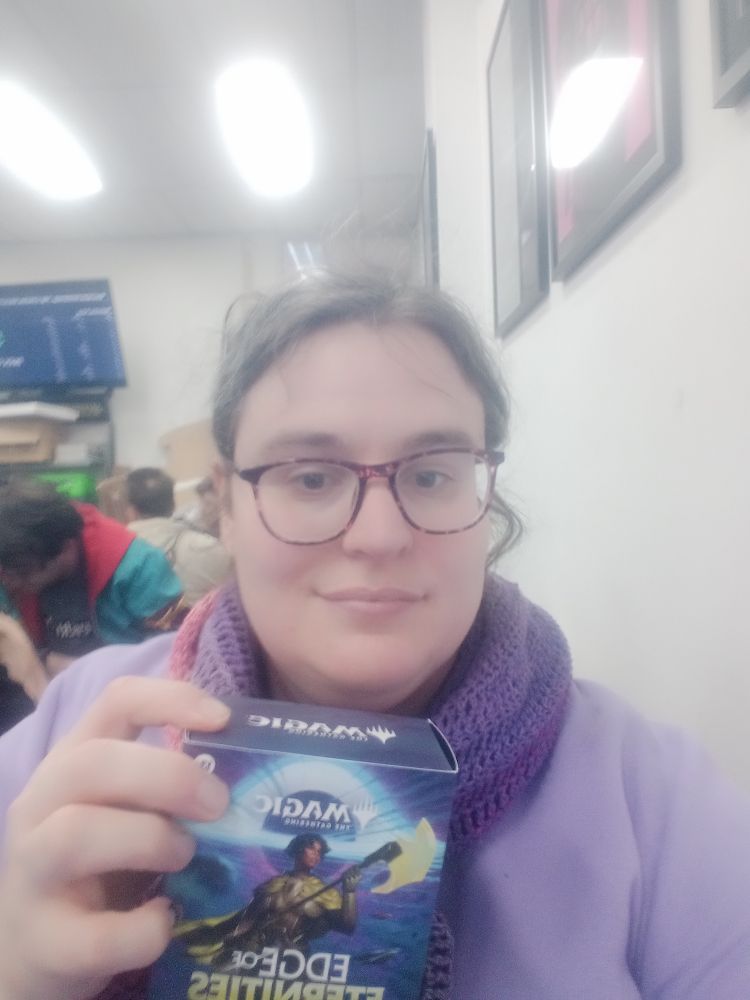 It's me, mim, holding an MTG edge of eternities prerelease kit