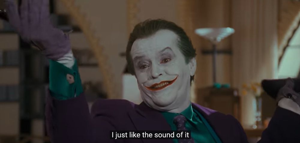 Still from Batman (1989) of Jack Nicholson as the Joker, saying "I just like the sound of it"
