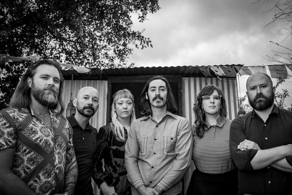 A black and which photo of the band "Murder By Death"